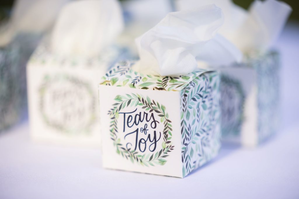 Close up shot of "Tears of Joy" tissue boxes at Wando River Grill wedding.